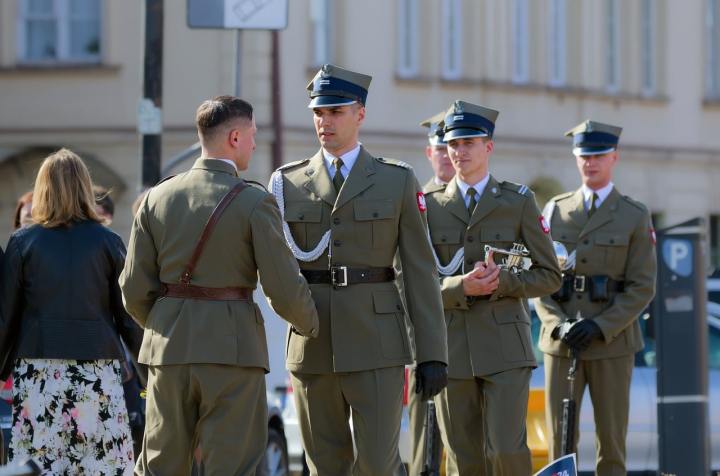 defence contractor meeting with uniformed soldier